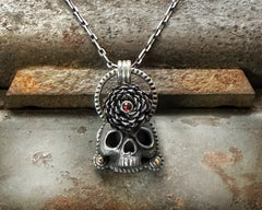 Skull with Flower and Garnet Necklace