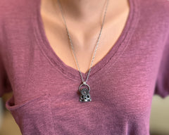 Skull with Flower and Garnet Necklace